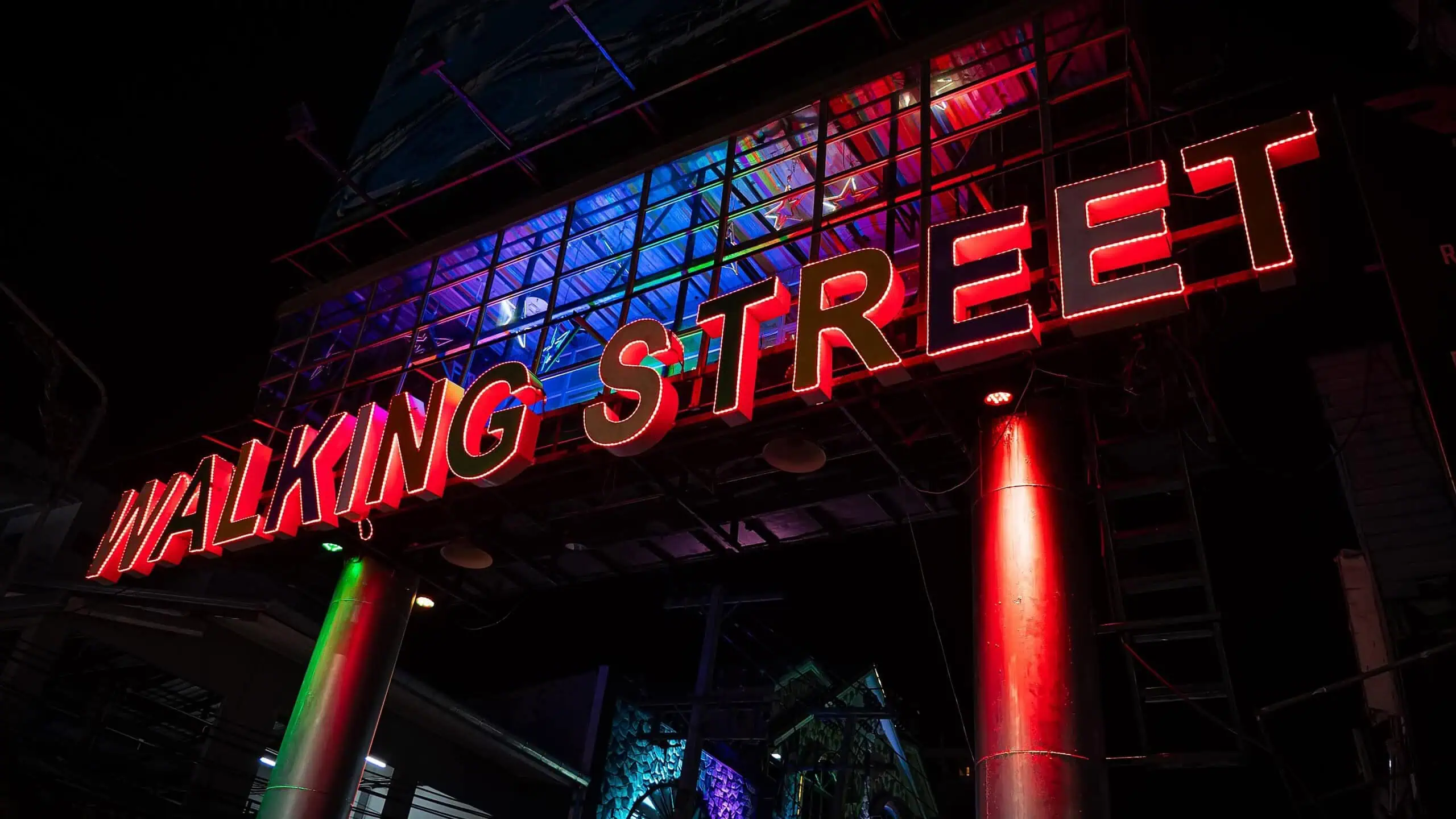 View of Pattaya walking street with various neon sign boards. Sign on Walking Street